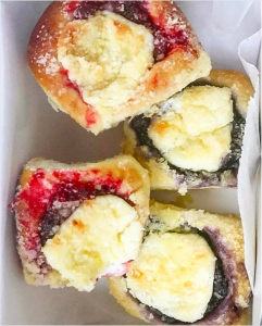 Box of strawberry and blueberry cream cheese kolaches